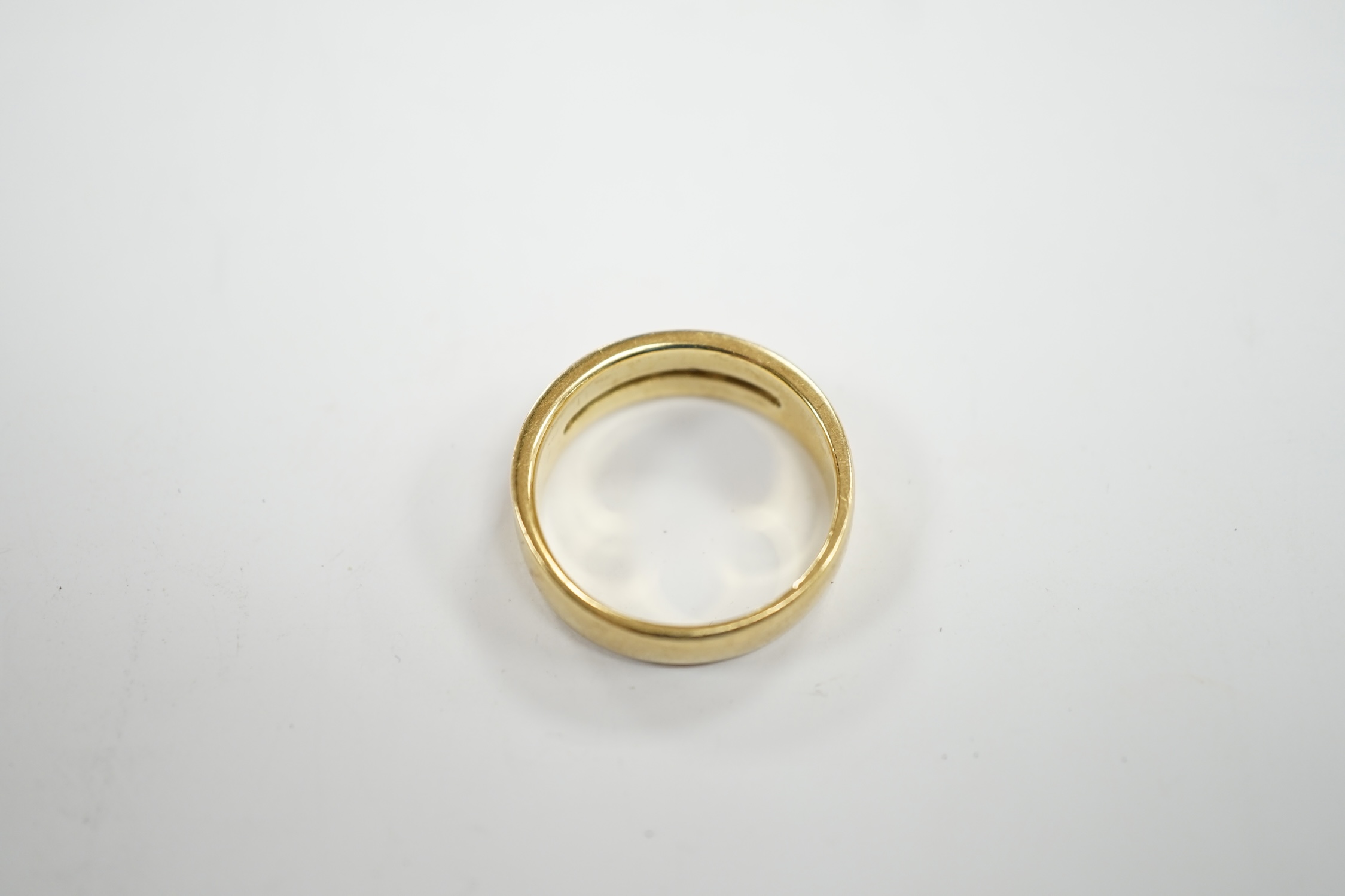 A modern 18ct gold and five stone diamond set half hoop ring, size O, gross weight 6.2 grams.